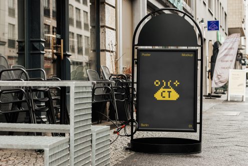 Urban street poster mockup on sidewalk with cafe seating background, ideal for realistic city advertising designs, outdoor graphic display.